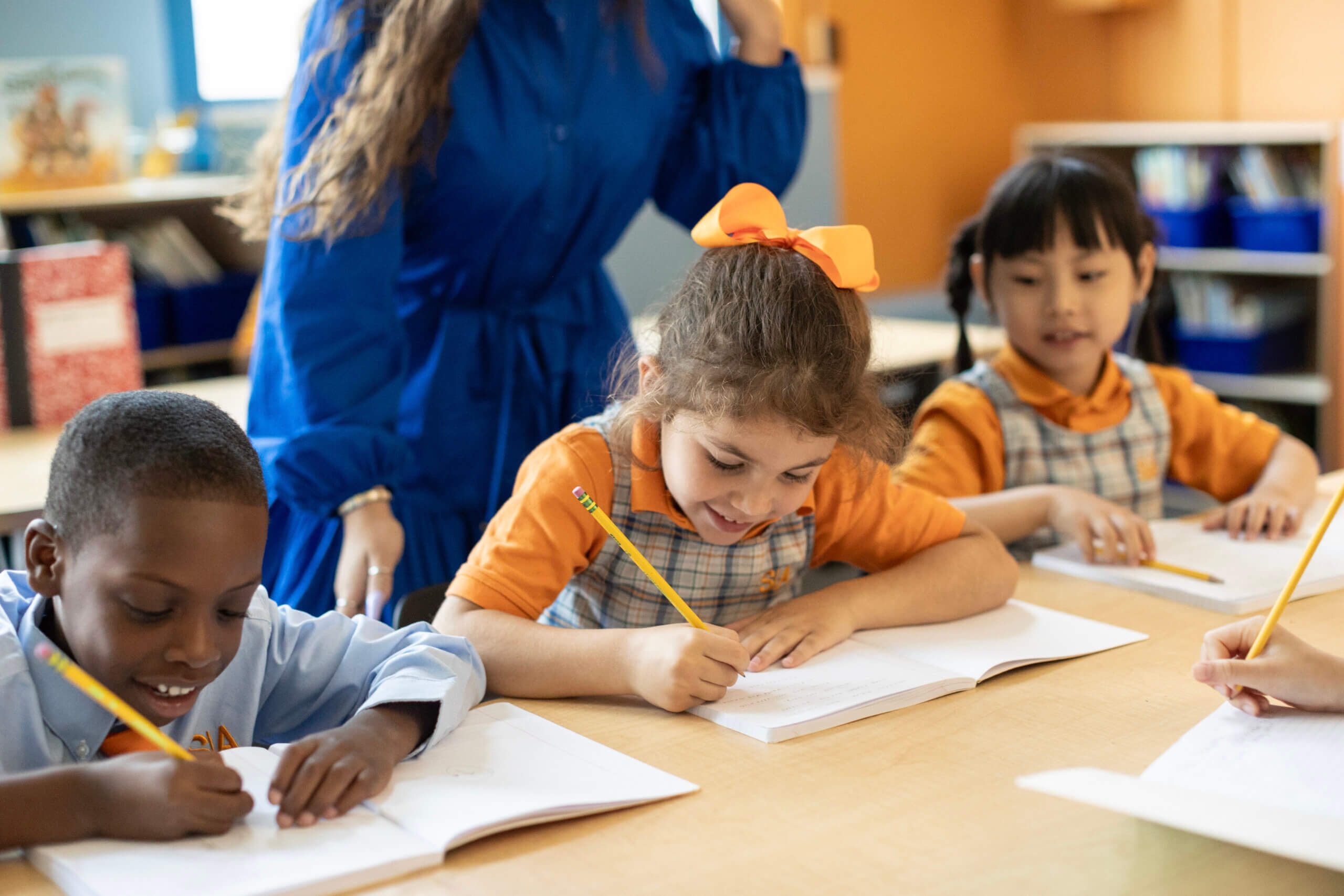 charter school students working in a notebook
