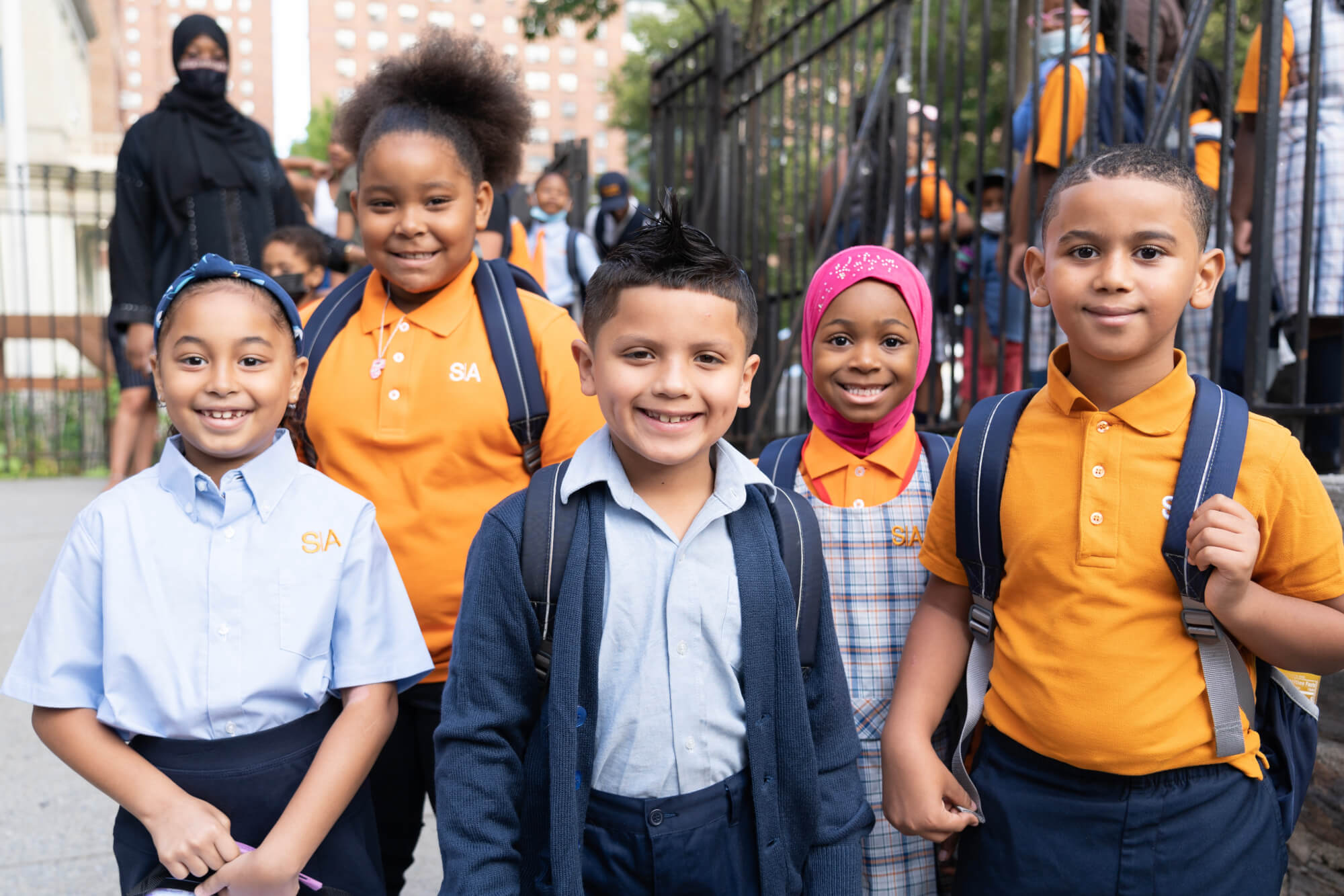 group of 5 students smiling