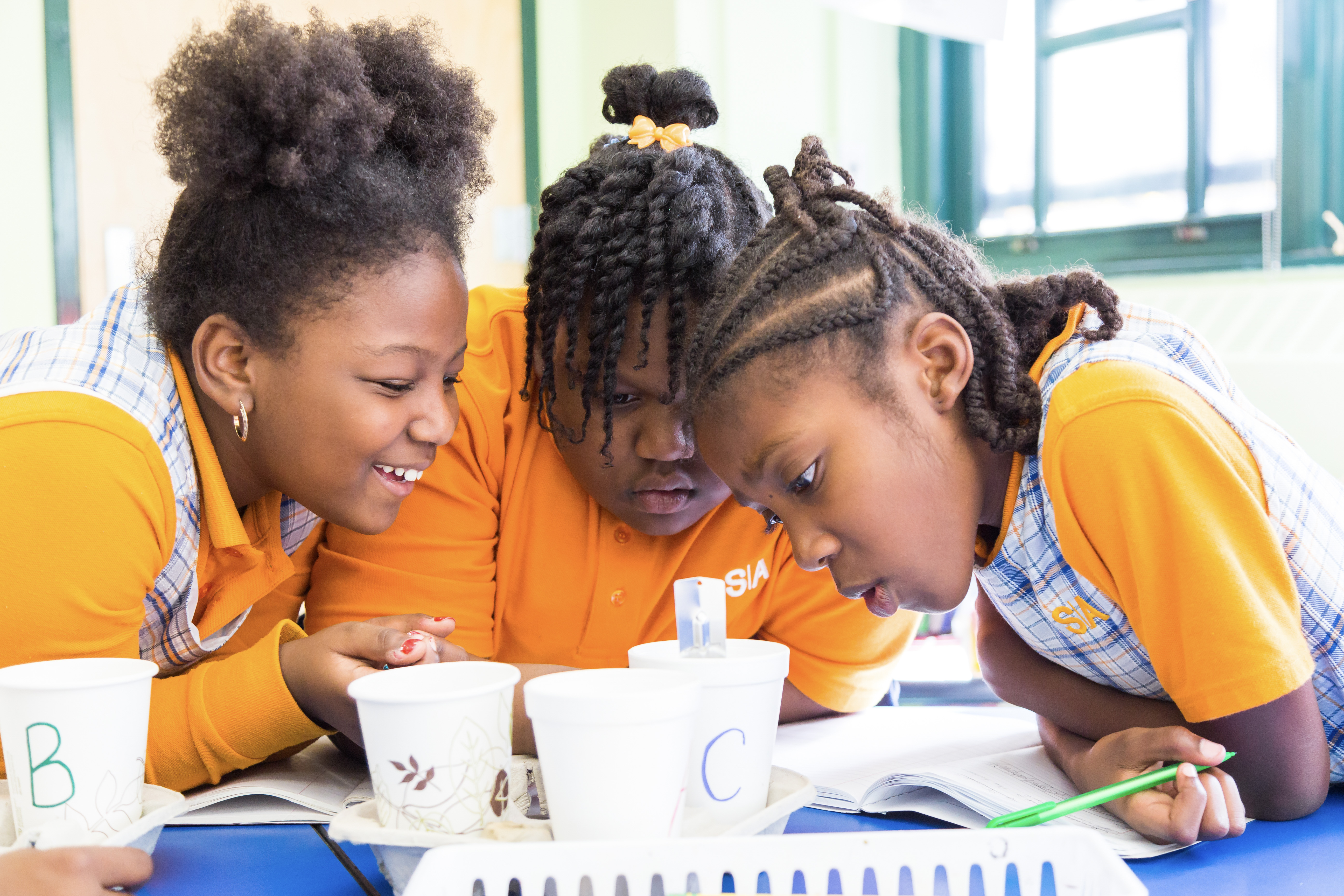 Three students working on a group science project
