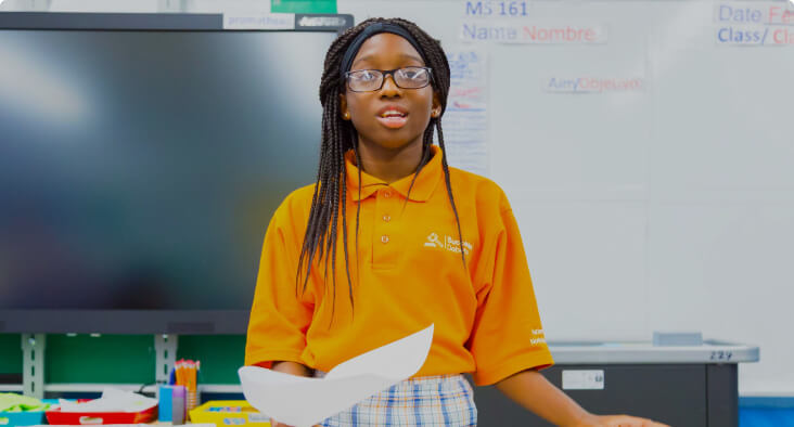 Student presenting during a debate session in a classroom