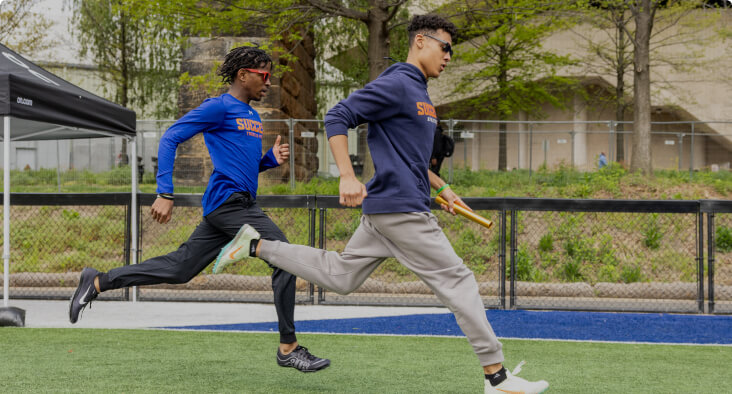 Students running on an outdoor track